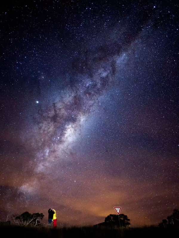 The Milky Way over a dark Australian landscape
